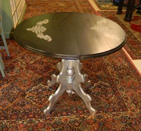 Black and Silver Center Foyer Table with baroque design on top; 33" dia., 29" h.