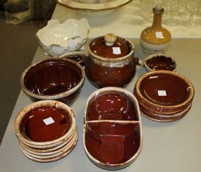 Group of USA Brown Stoneware Dishes Including 7"dia. Plates, 6" dia. Bowls, divided dish, covered pot, missing bowl, 2"-7" dia. Plates, 2"-5" dia. Bowls, porridge cup, Armour & company jug, center bowl.