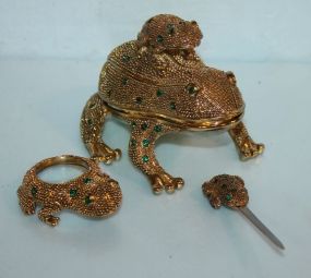 Frog Gold color probably brass frog w/green glass spots; 3 1/2"l.
