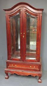 Reproduction Mahogany Chippendale Style Glass Cabinet Has two glass doors, glass sides, three glass shelves, ball and claw feet. 33 1/2"w., 16"d., 74"h.