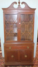 Small Mahogany China Cabinet with Broken Pediment Top, Two Latticework Doors, Drawer and Two Doors 34"w., 15"d., 75"h.