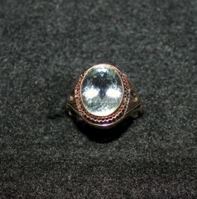 Ladies 14kt. Yellow Gold Ring with Oval Shaped Aquamarine Bezel Set