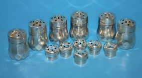 Six Sterling Shakers with lids and Six Sterling Lids