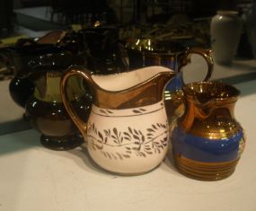 Four Luster Pitchers