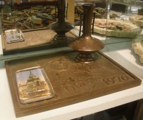 Lot includes bronze plaque of centennial, bronze vase, paperweight