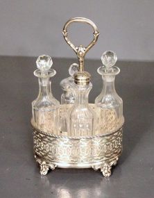 Four Cruet Bottles and Silverplate Stand