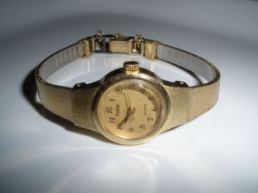 Ladies yellow tone yellow band Pulsar watch.