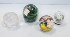 Four Paperweights