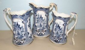 Three Flow Blue Style Graduated Pitchers