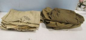 Two Military Bags and Three Feed Sacks