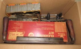 Collection of Gun Cleaning Tools and Planer