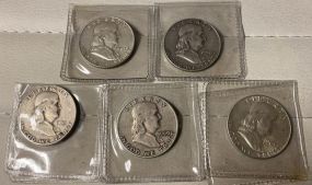 Five Franklin Half Dollars