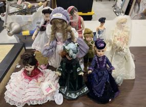 Grouping of Collectable Dolls on Stands
