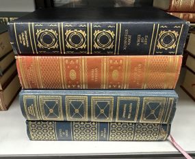 Four Gold Leather Bound Books