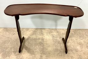 Kidney shape trestle style table 27"h., 39"w.