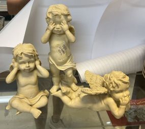 Three Resin Cherub Figurines