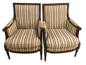 Pair of French Louis XVI Walnut Upholstered Bergeres
