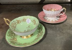 Two Porcelain Demitasse Cups and Saucers