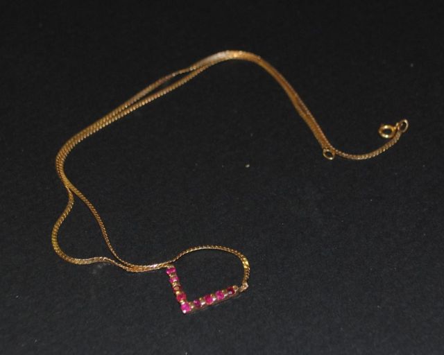 Lady's "V" Shaped Ruby Pendent on a Flat Necklace Chain