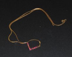 Lady's "V" Shaped Ruby Pendent on a Flat Necklace Chain