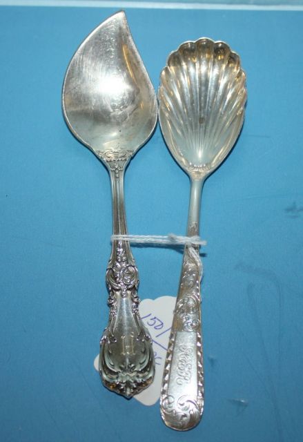 Sterling S. Kirk and Son Sugar Spoon along with a Sterling Reed and Barton Jelly Server in the "Burgundy" Pattern