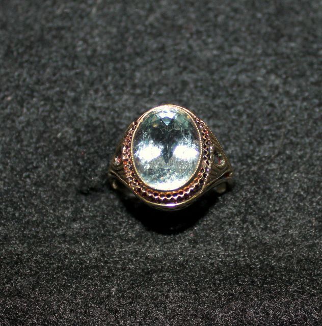 Ladies 14kt. Yellow Gold Ring with Oval Shaped Aquamarine Bezel Set