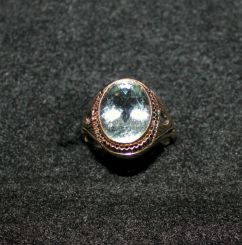 Ladies 14kt. Yellow Gold Ring with Oval Shaped Aquamarine Bezel Set