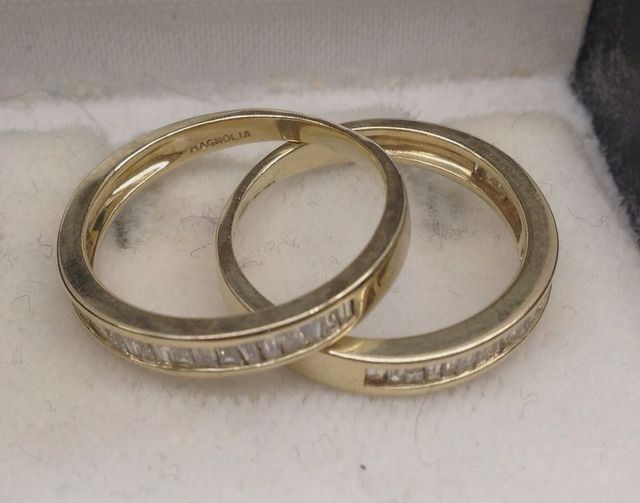 Two 14KT yellow lady's cast diamond anniversary bands
