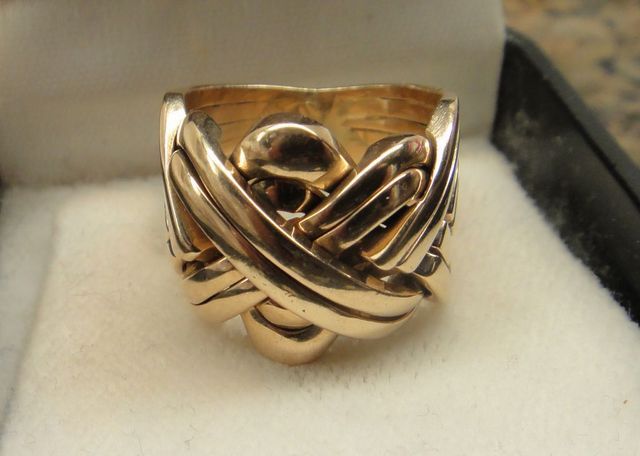 One 14KT Yellow Gold Lady's Cast Fancy Band