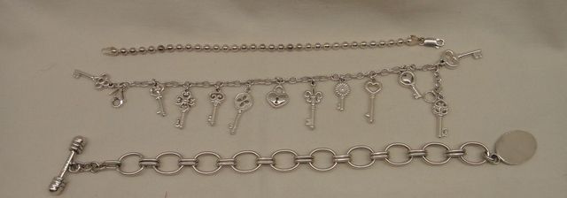 Three Sterling Lady's Charm and Link Bracelets