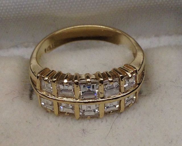 One Stamped 14KT Yellow Gold Lady's Cast Diamond Band