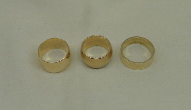 Three stamped 14KT yellow gold lady's band