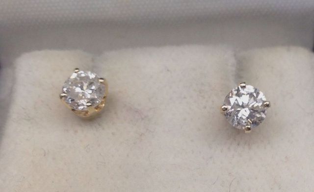 One pair stamped 14KT yellow gold lady's die struck diamond stud earrings