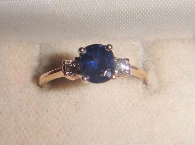 One stamped 14KT yellow gold lady's cast sapphire and diamond ring