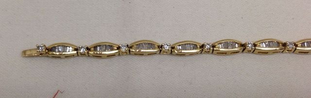 One Stamped 14KT Yellow Gold Lady's Cast Diamond Baguette Tennis Bracelet