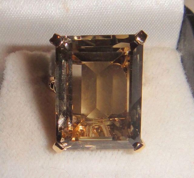 One 10-14KT yellow gold lady's cast smoky quartz ring