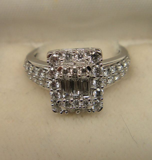 One stamped 14KT white gold lady's cast diamond ring