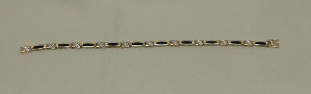 One stamped 10KT yellow gold lady's cast synthetic sapphire and diamond bracelet
