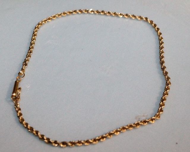 One stamped 14KT yellow gold lady's 2.5mm thick, 10" long rope anklet