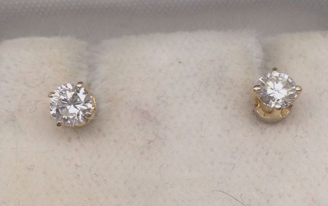 One pair stamped 14KT yellow gold lady's die struck diamond stud earrings