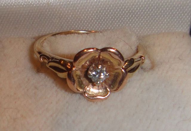 One 10-14KT yellow gold lady's cast diamond rose ring