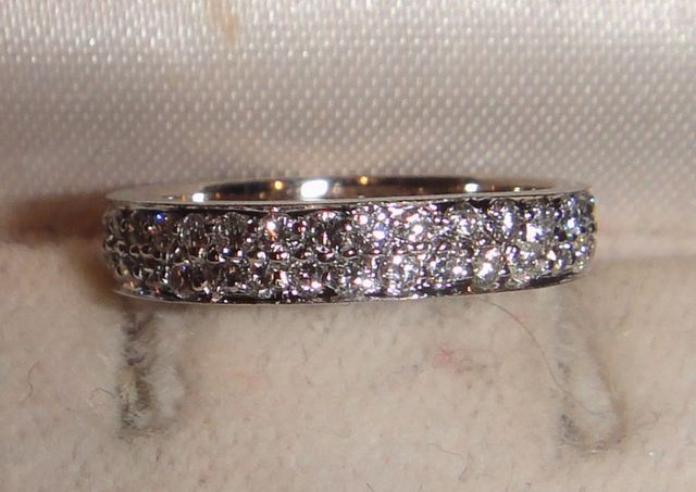 One Stamped 14KT White Gold Lady's Cast Pave' Diamond Band