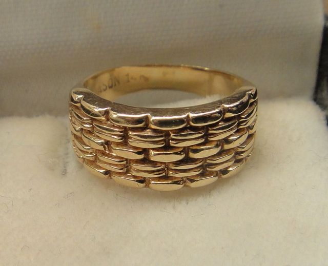 One 14KT Yellow Gold Lady's Cast Fancy Bands