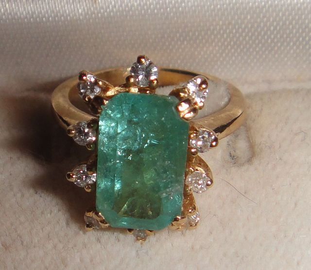 One 10-14KT yellow gold lady's cast emerald and diamond ring