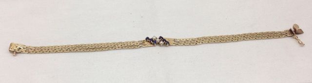 One stamped 14KT yellow gold lady's 7.5" Sapphire and pearl bracelet