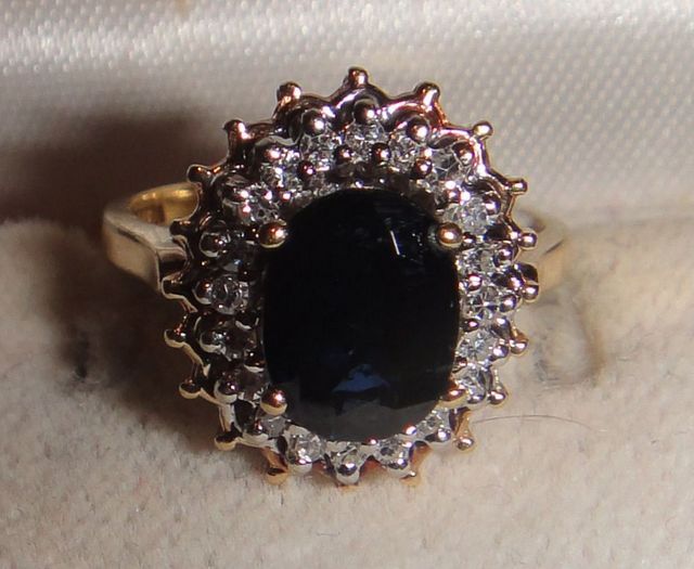 One stamped 14KT yellow gold lady's cast sapphire and diamond ring