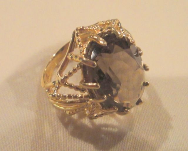 One stamped 14KT yellow gold lady's cast smoky quartz ring