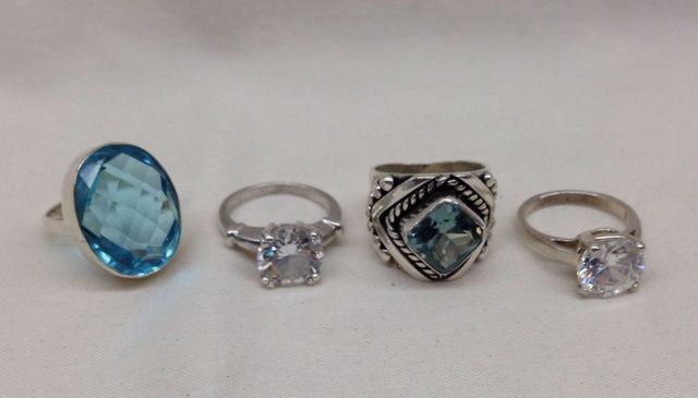 Four Stamped Sterling Silver Lady's Simulated Gemstone Rings