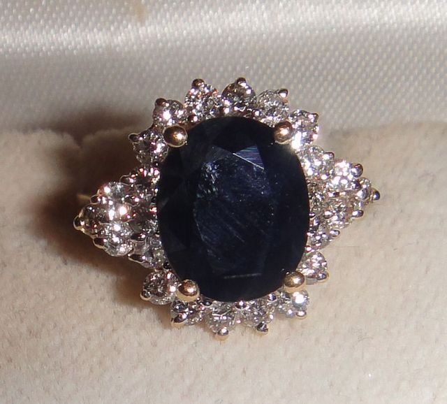 One stamped 14KT yellow gold lady's cast sapphire and diamond cluster ring