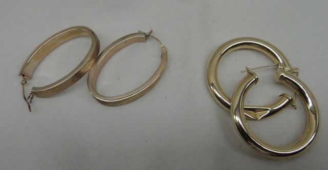 Two sets of stamped 10-14KT yellow gold lady's hoop earrings